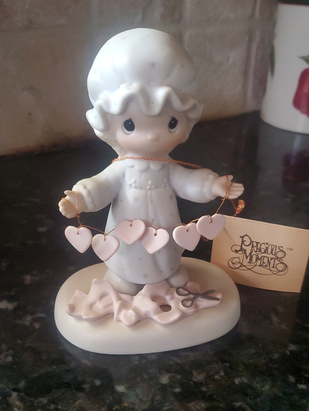Precious Moments White and Pink Girl Figurine Holding Heart Garland